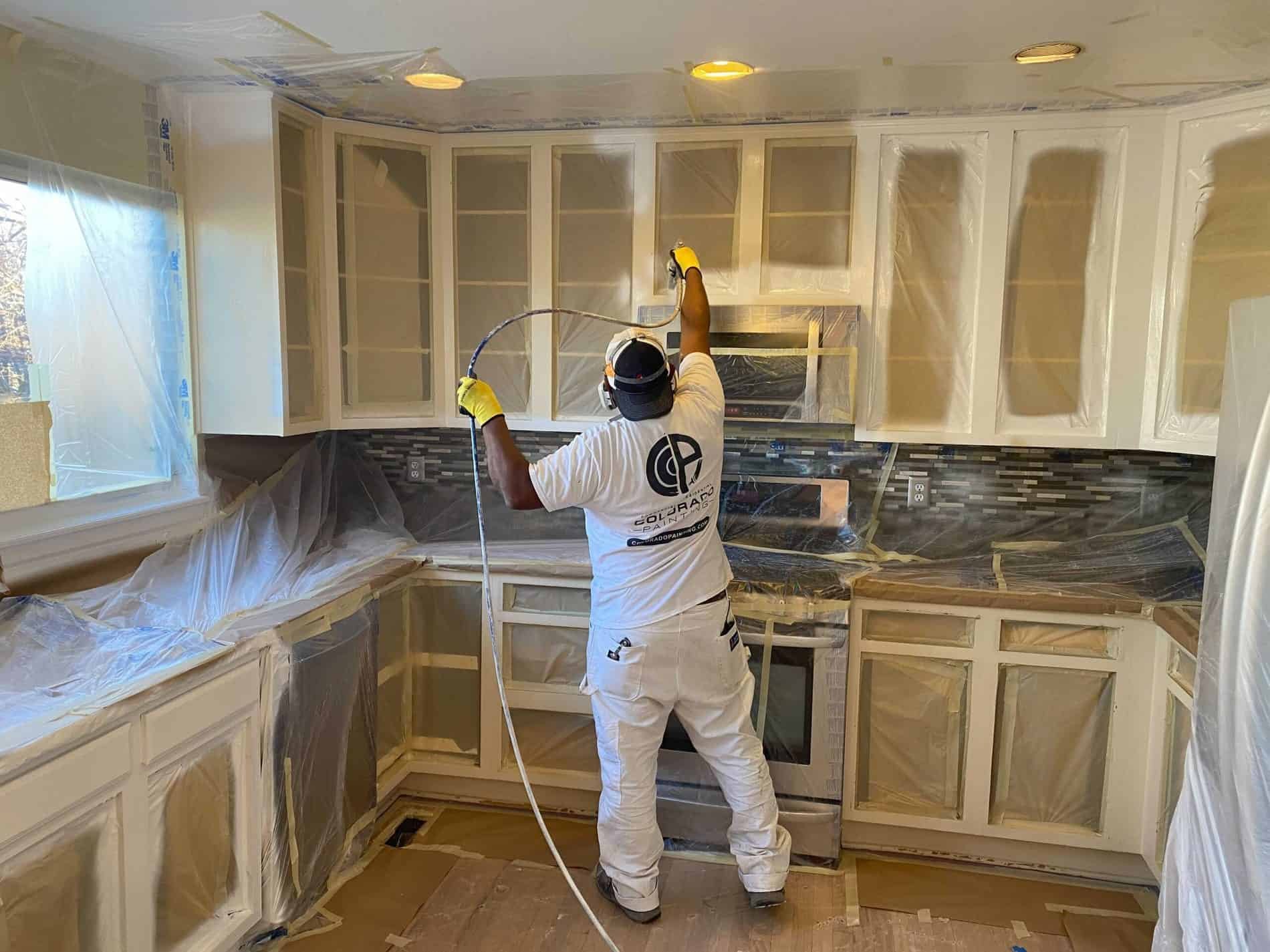 Freshly painted white kitchen cabinets with clean, smooth finish in a Kingman, Arizona home. Cabinet doors and drawer fronts show even color coverage with no brush marks or drips.